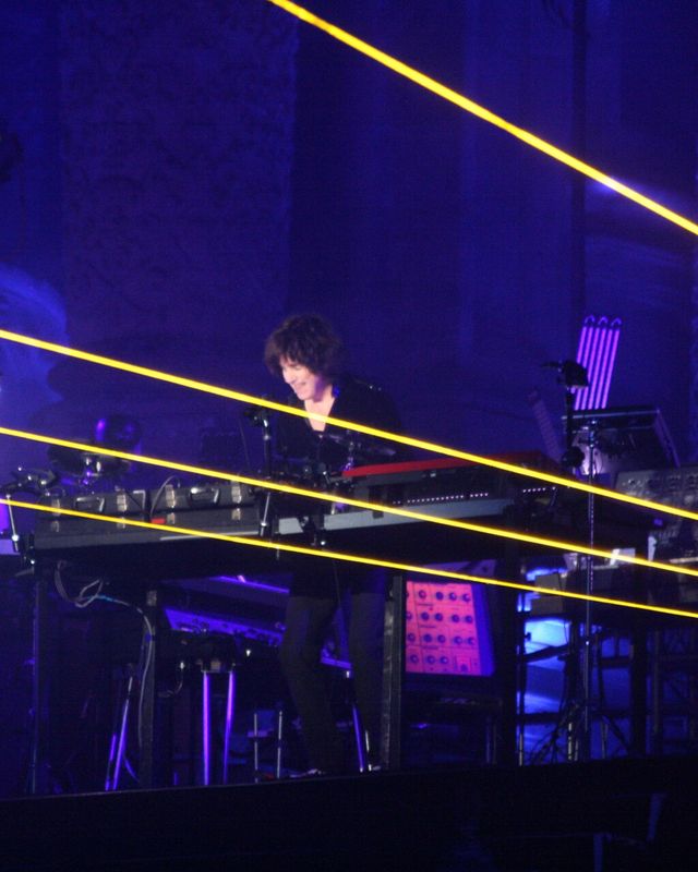 Jean-Michel Jarre on stage under green laser beams