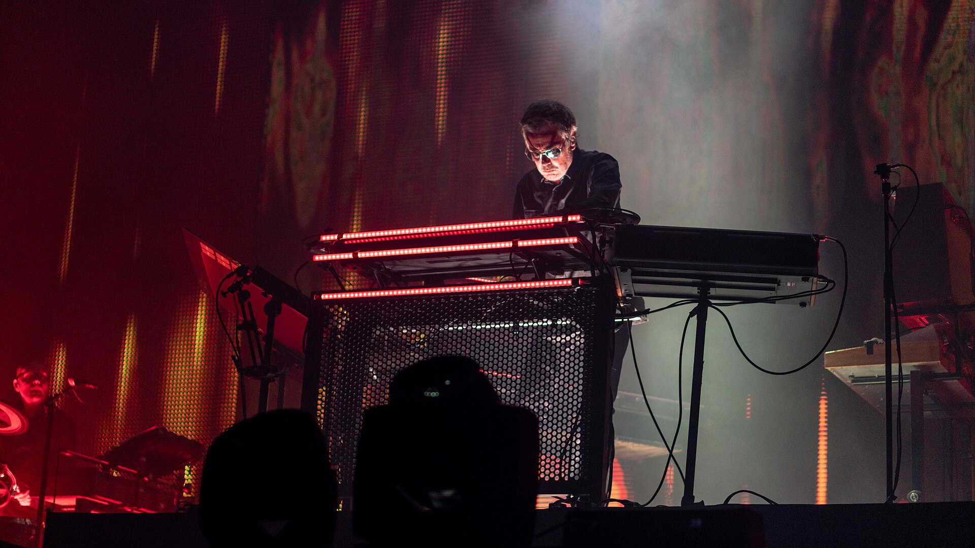 Jean-Michel Jarre playing synthesizers on stage