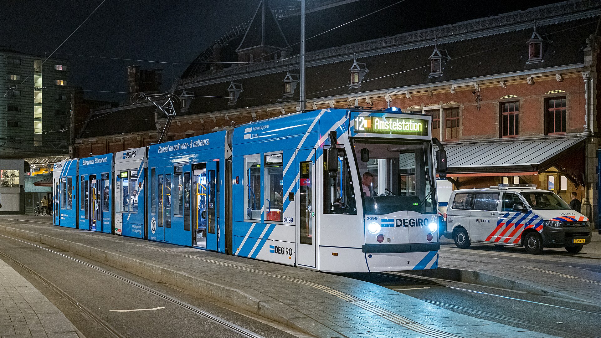 A GVB tram arriving at Amsterdam Centraal after dark